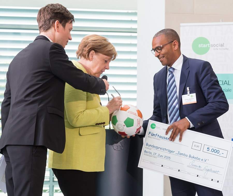 Clemens Mulokozi und Angela Merkel