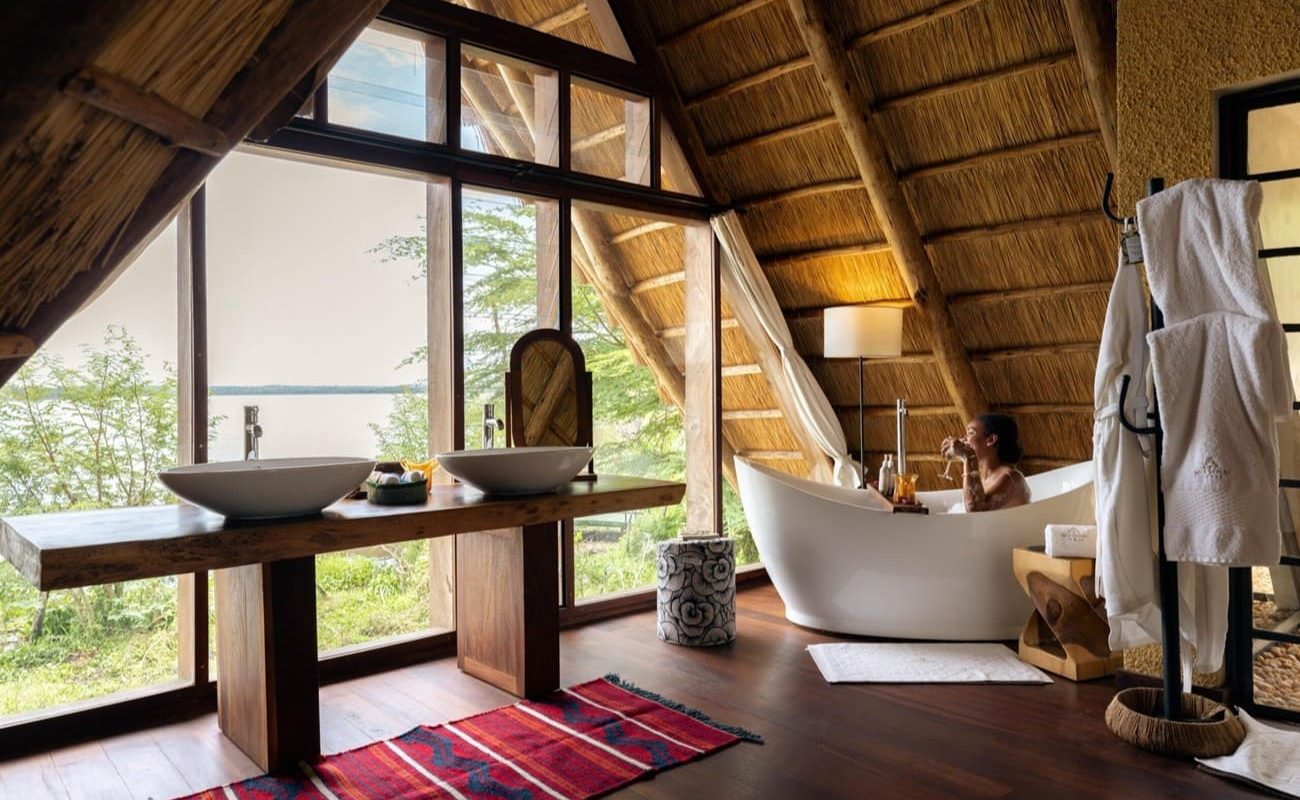 Nile Safari Lodge Deluxe Banda Bad Bad einer Deluxe Banda, Nile Safari Lodge